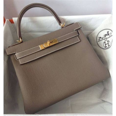 hermes etoupe retourne kelly 28 gold hardware|kelly 28 Hermes.